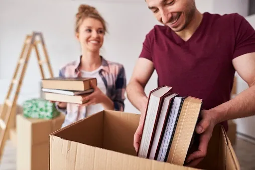 Couple packing books